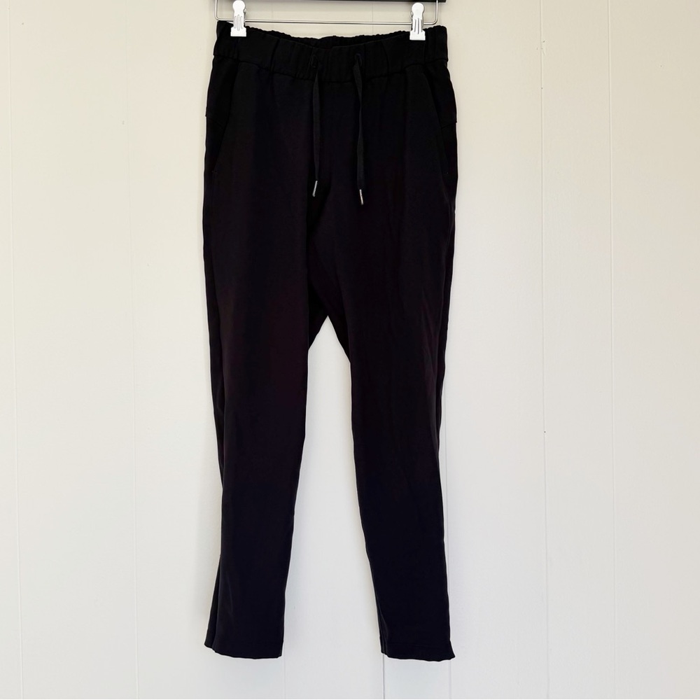 LULULEMON On the Fly 7/8 Pant Woven Black Size 4 LW5BPMS